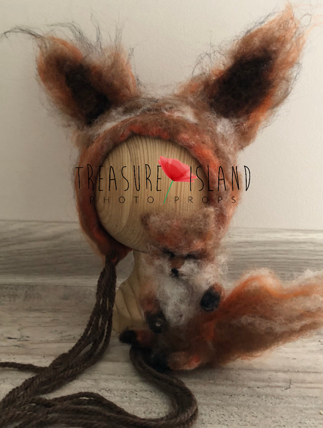 Felted fox head with long fur on a wooden block, branded 'Treasure Island Photo Props'.