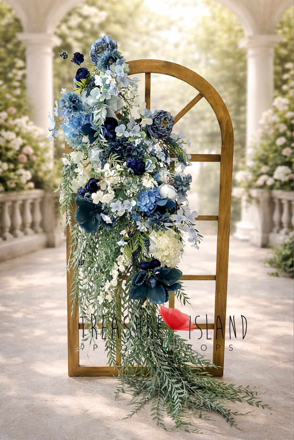Blue and white cascading floral arrangement on gold arched frame – luxury wedding backdrop decor