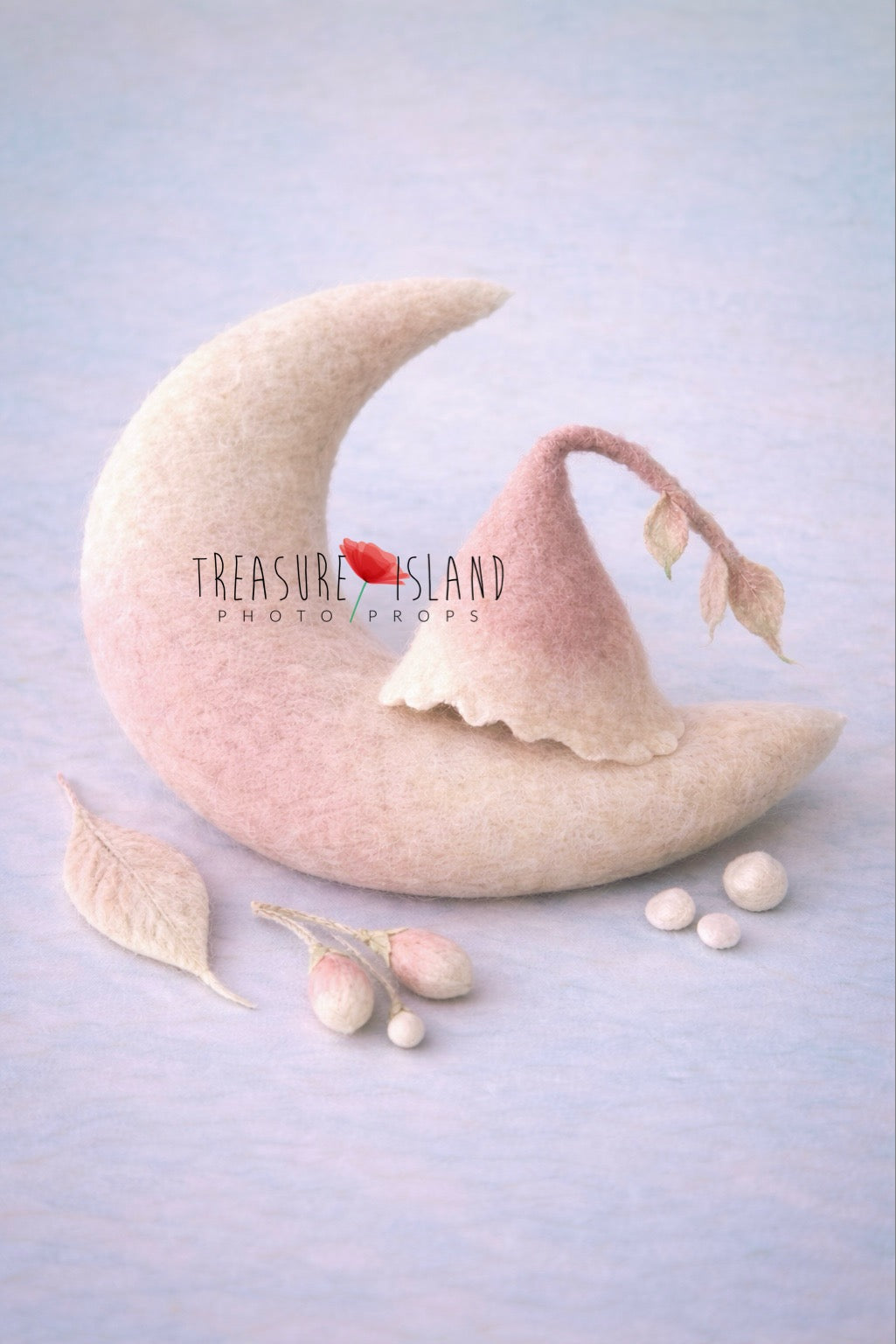 Hand felted newborn photo prop set featuring blush and cream crescent moon pillow, matching wool bonnet with leaf detail, felted leaf, floral buds and tiny dew drops
