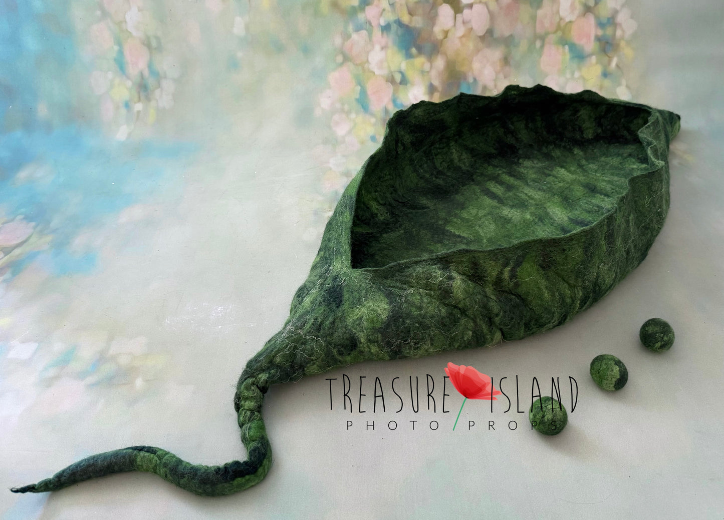 Handmade felted Pea Pod Nest for newborn photography, sculptural emerald green leaf basket made from natural wool with matching felted peas, unique newborn photo prop for fine art sessions