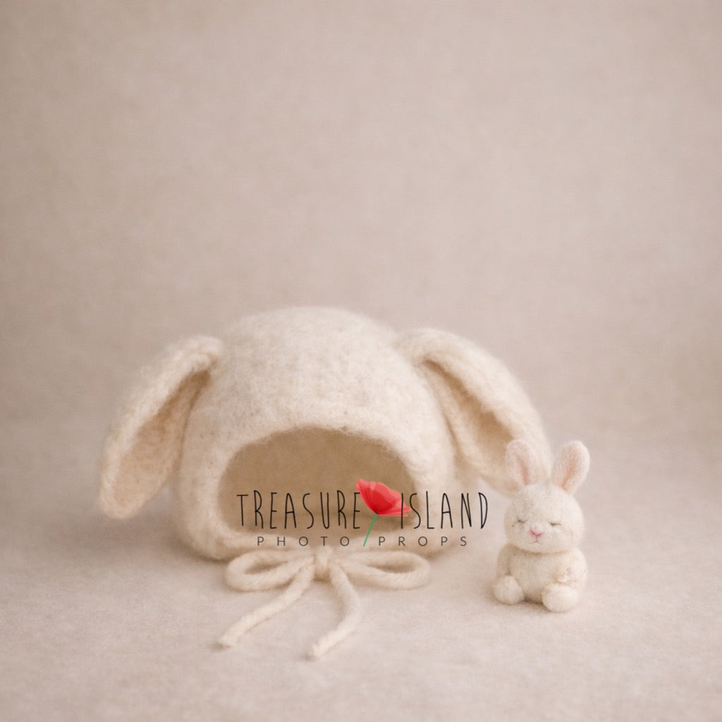 Hand-felted bunny bonnet paired with a miniature rabbit companion, handmade from merino wool for newborn photography and fairytale-inspired sessions