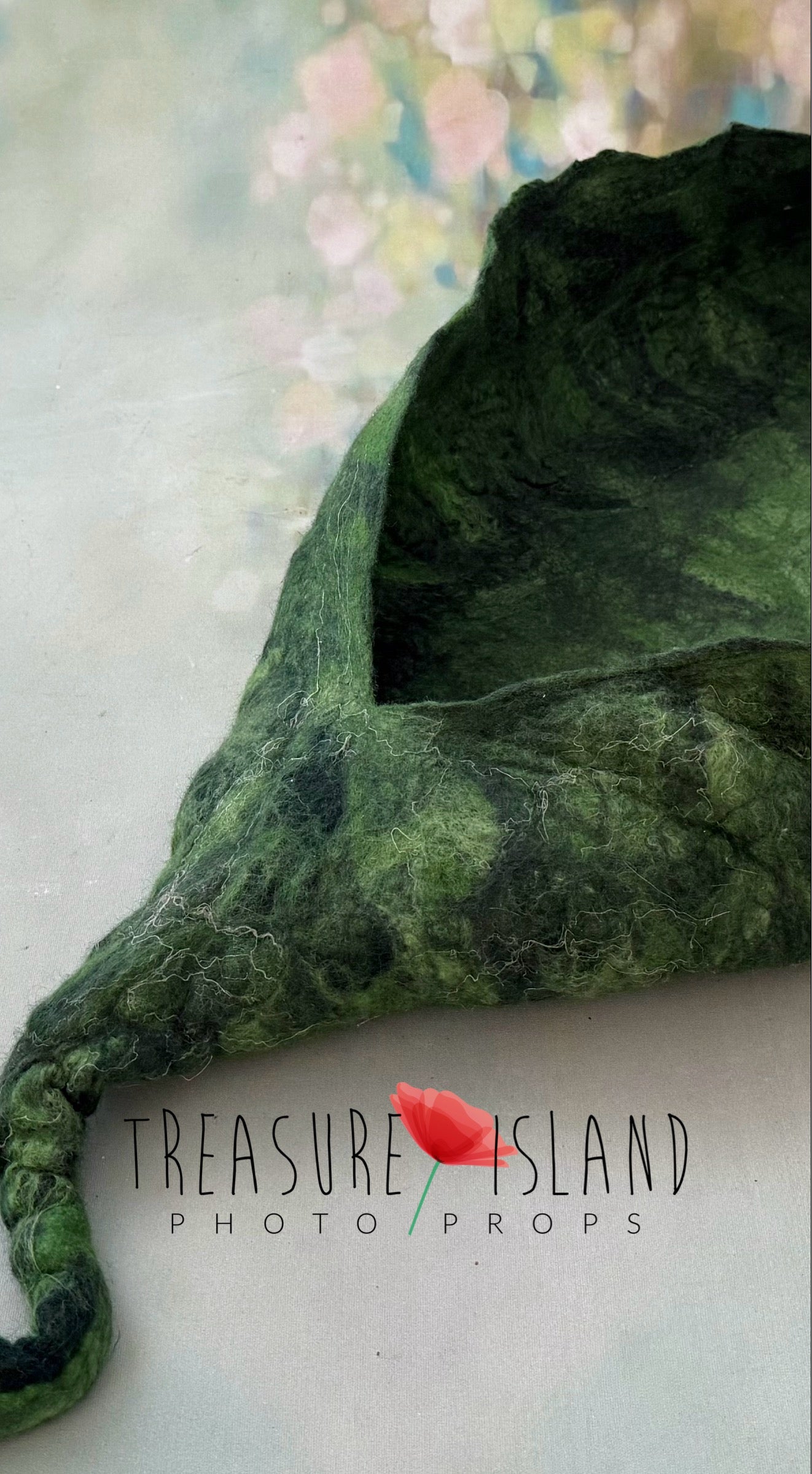 Close-up of handmade felted Emerald Whisper Pea Pod Nest showing detailed natural wool texture and sculpted leaf shape, premium newborn photography prop