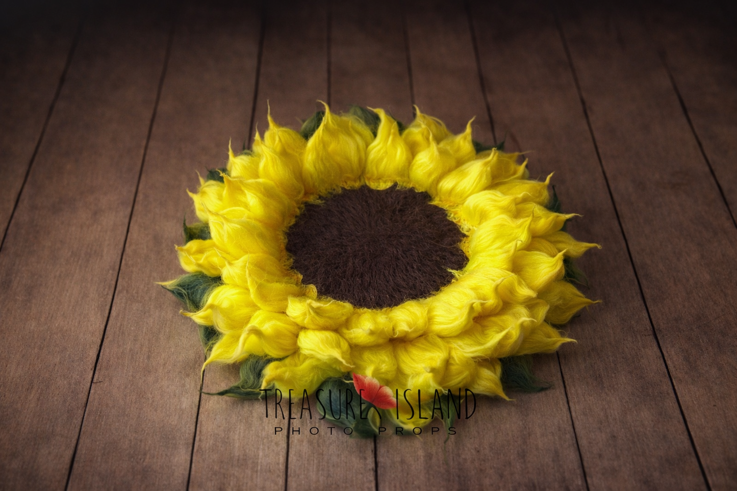 Handfelted sunflower newborn photography prop on rustic wooden floor, yellow wool petals with textured dark brown center by Treasure Island Photo Props
