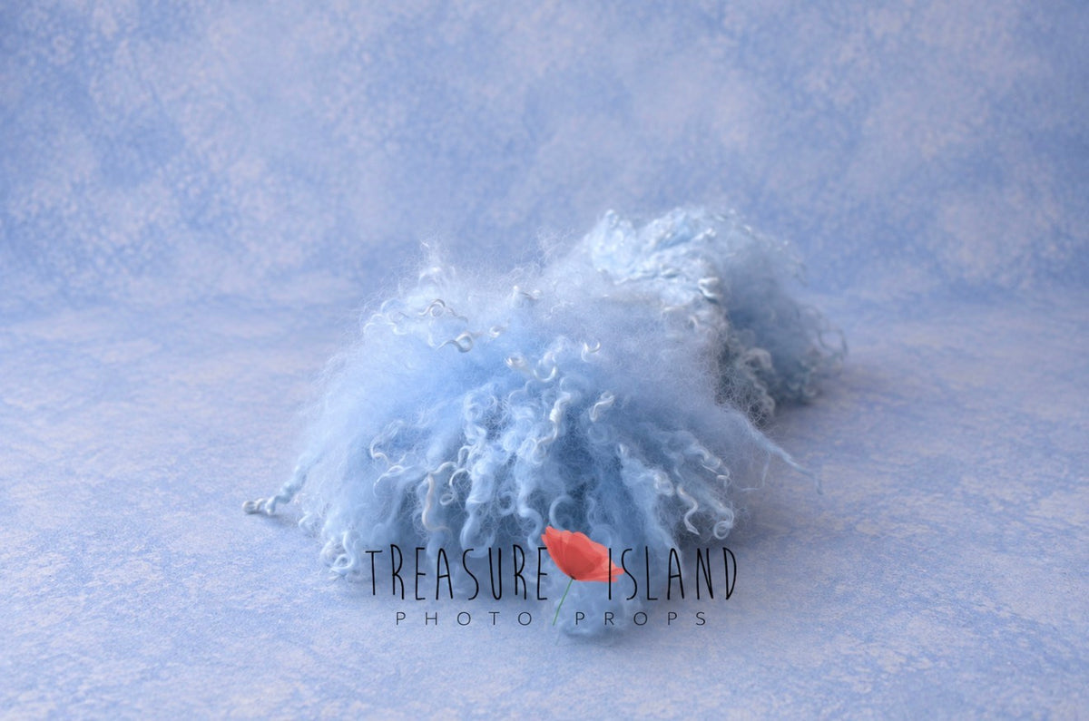 Light blue handmade newborn photography layer felted from natural sheep wool with long curly sheep locks