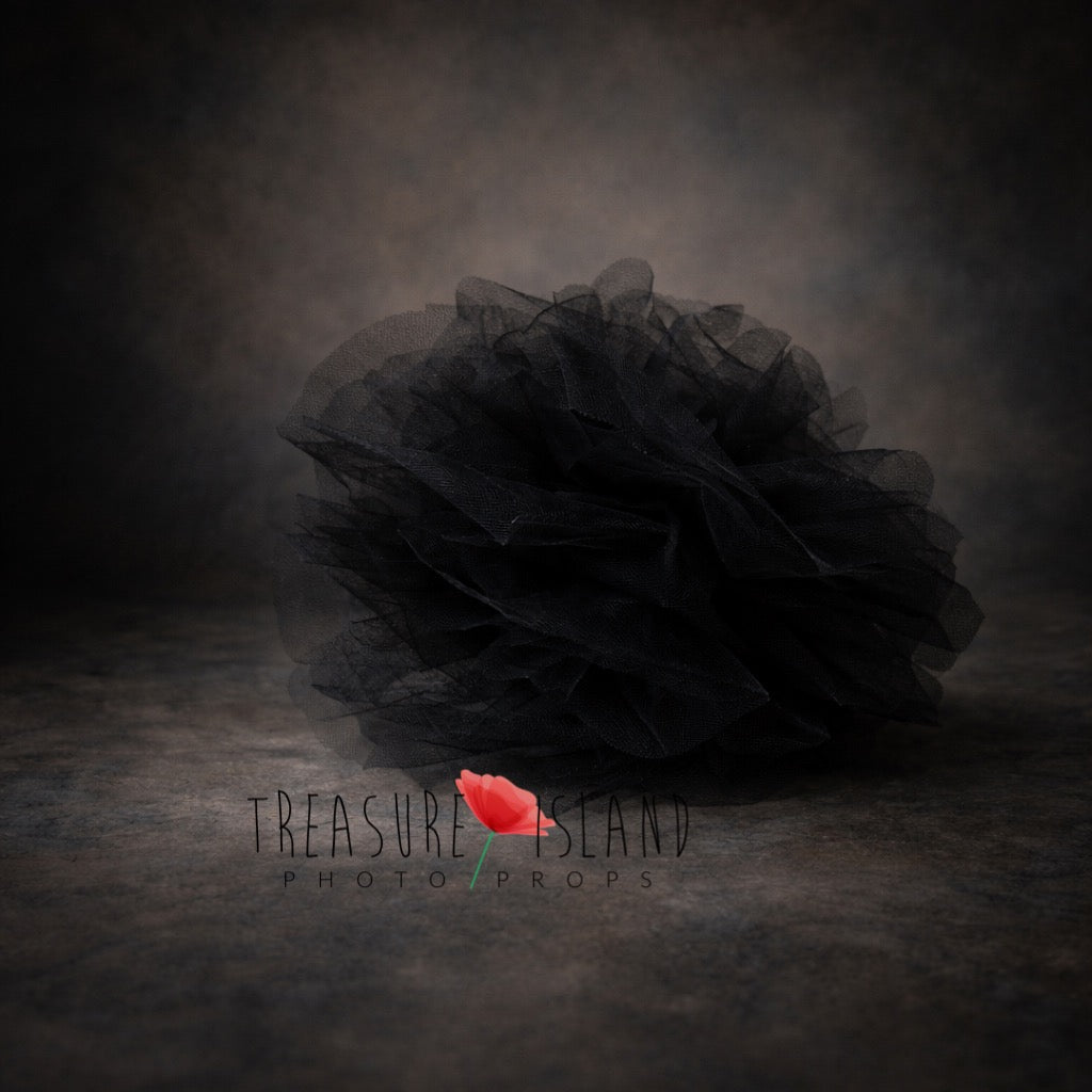 Black tulle newborn photography prop on dark fine art background, soft layered texture, moody luxury styling
