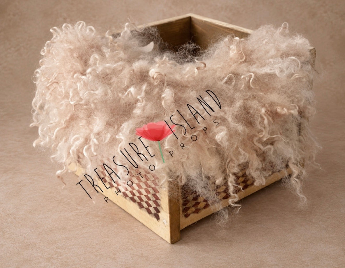 Close view of cappuccino felted wool photography blanket showing soft natural sheep curls and handmade texture