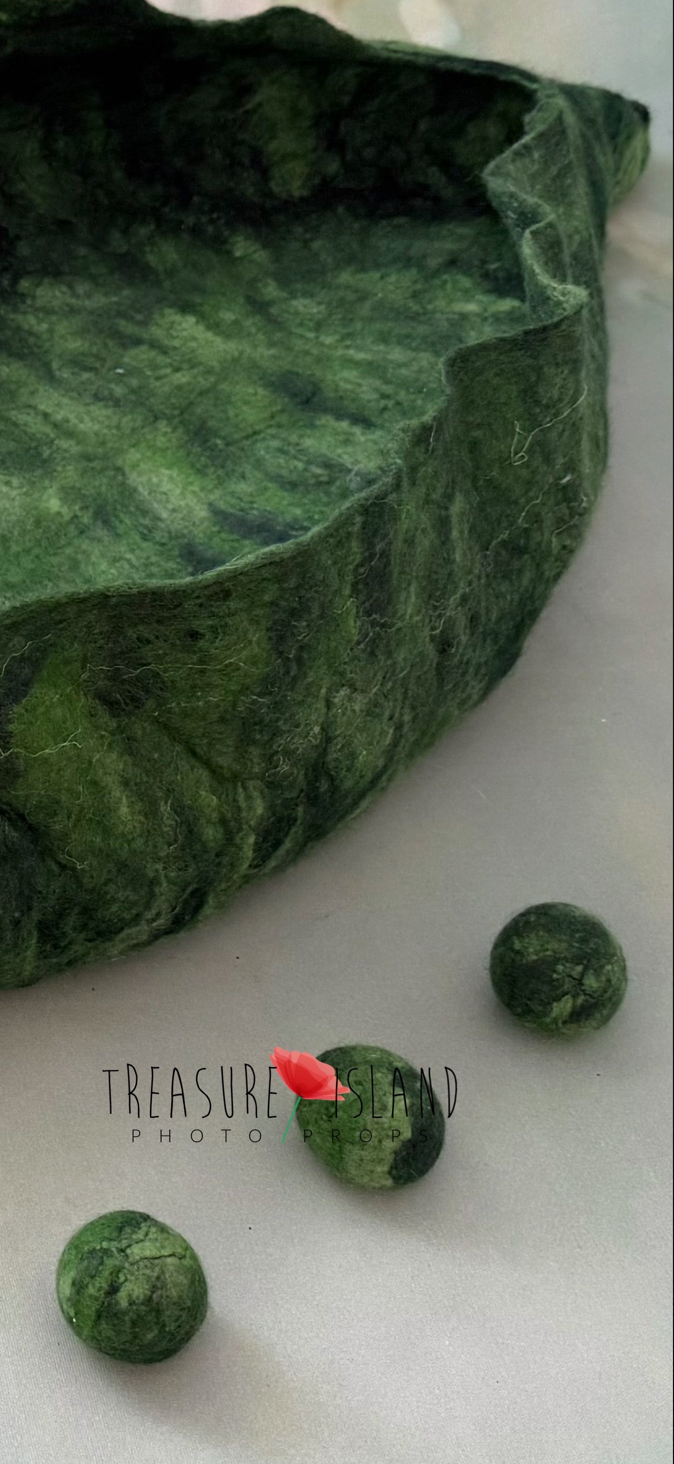 Detailed view of Emerald Whisper Pea Pod Nest with hand felted peas, artisan newborn photography prop crafted from natural wool in rich emerald green tones