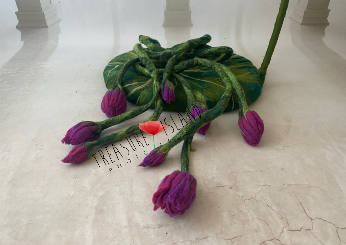 Close-up of sculptural wool flowers and buds on Thumbelina newborn prop