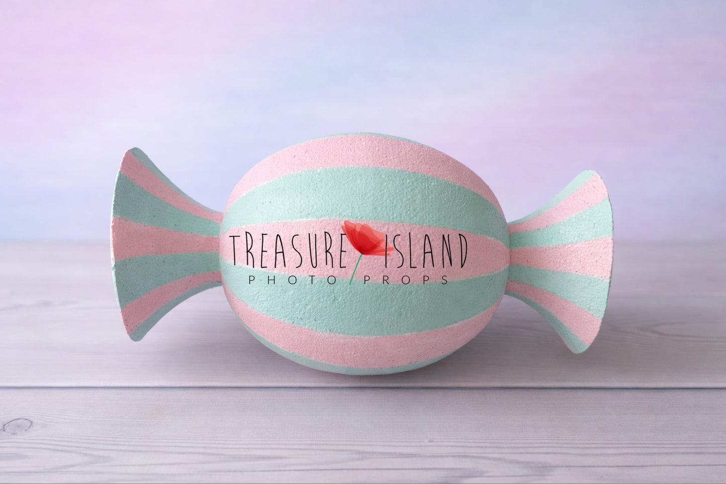 Pastel pink and mint faux candy prop for cake smash photography, hand-painted striped design on studio background