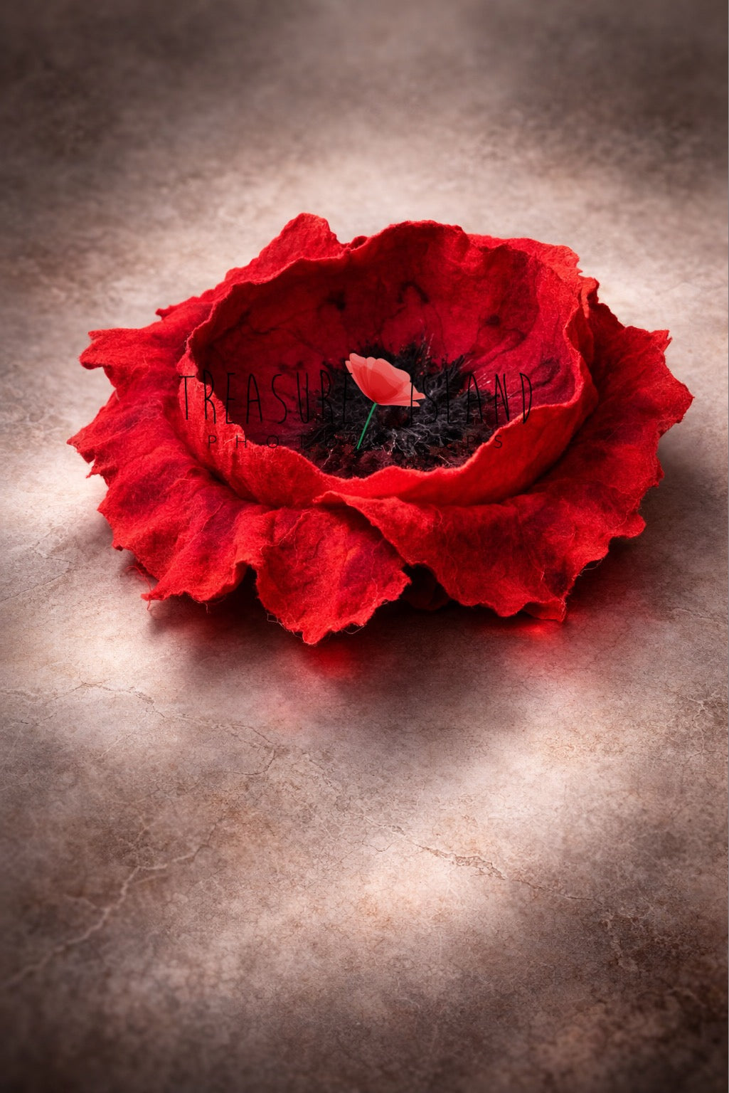 Handmade dramatic red felted poppy bowl with layered petals for newborn photography styling
