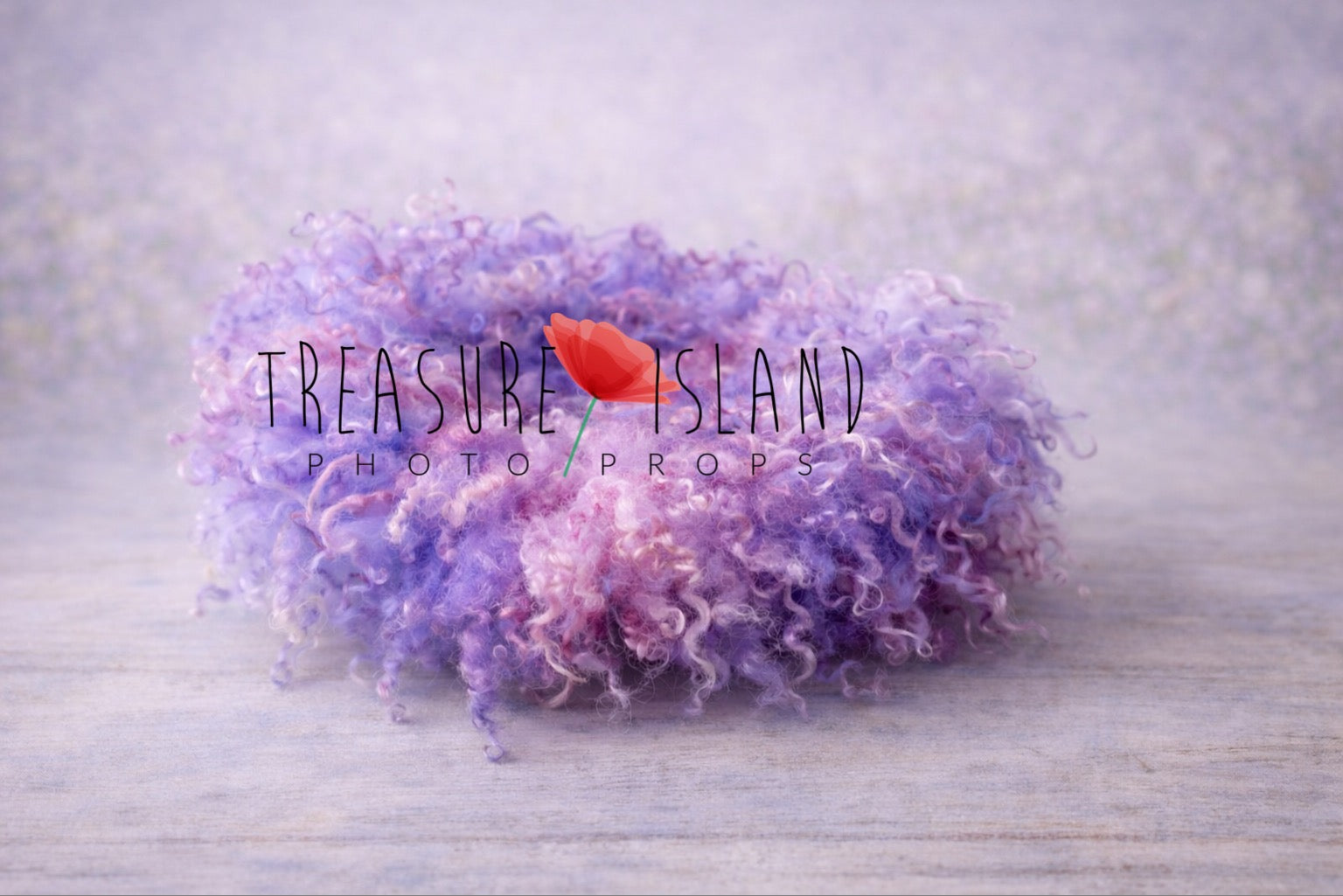 Hand-felted newborn photography curly blanket in soft and lavender, blush pink and delicate purple  color, made from natural curly sheep wool, styled on a delicate pastel backdrop. Treasure Island Photo Props.
