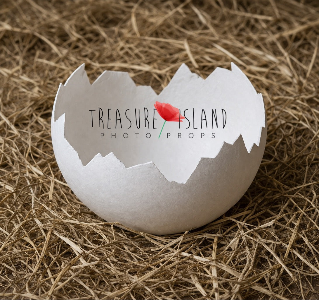 handmade white eggshell newborn photography prop on rustic wooden floor with straw natural organic setup