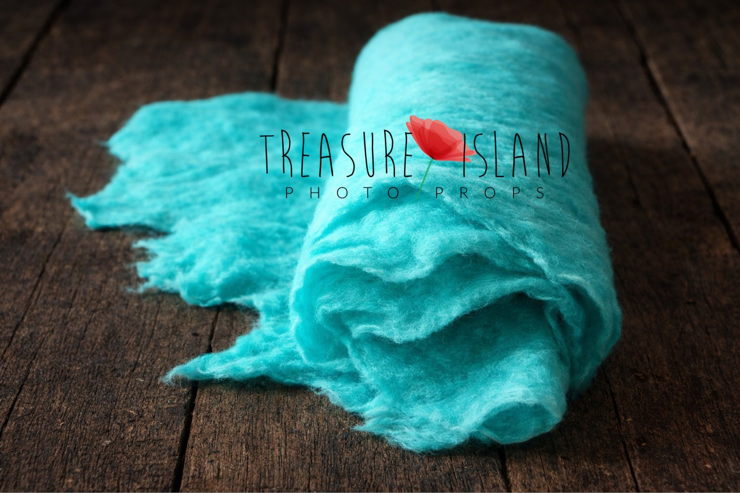 Ocean turquoise thin felted wool wrap showing handmade irregular edges