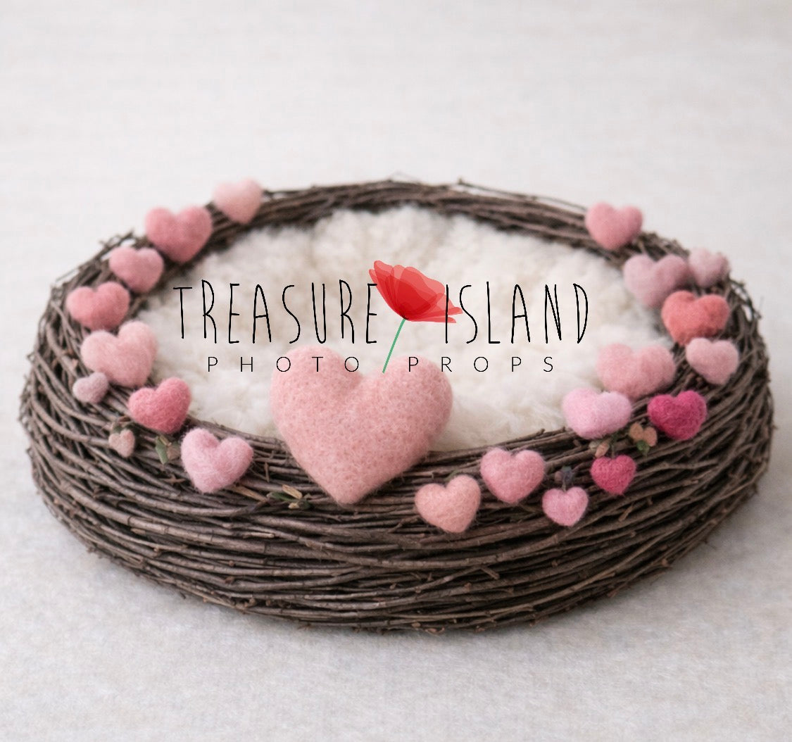 Valentine newborn photography nest with pastel pink felted hearts and soft ivory interior