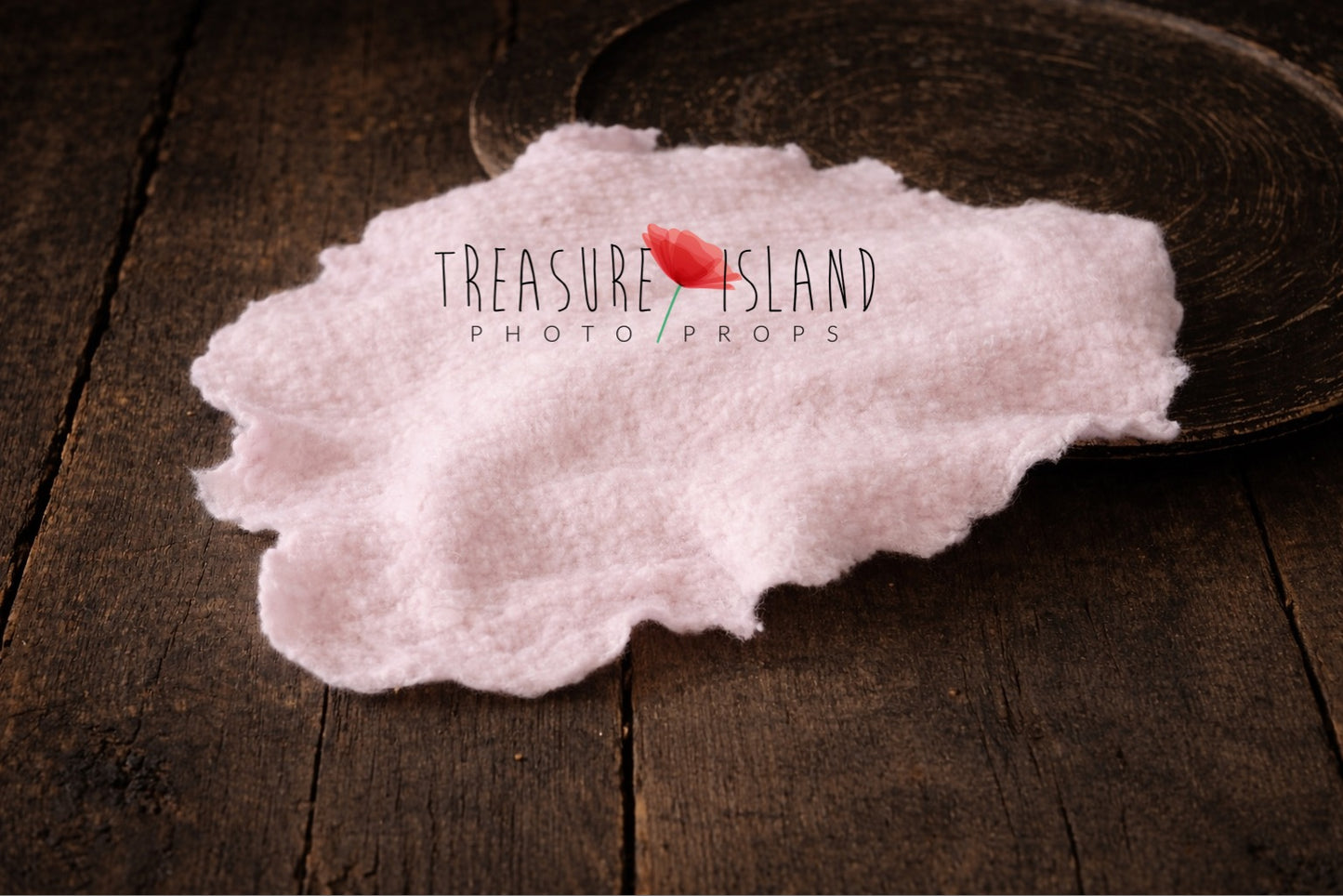 Very light pink hand-felted irregular wool blanket with organic edges in 20x30 cm size