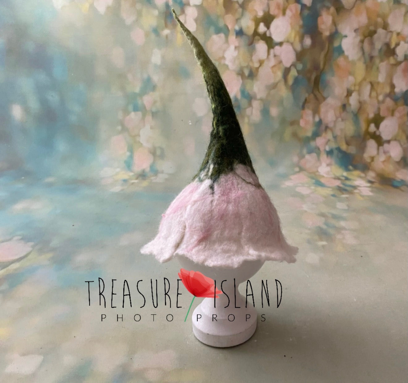 Blush pink hand-felted flower bonnet with long green stem for newborn photography