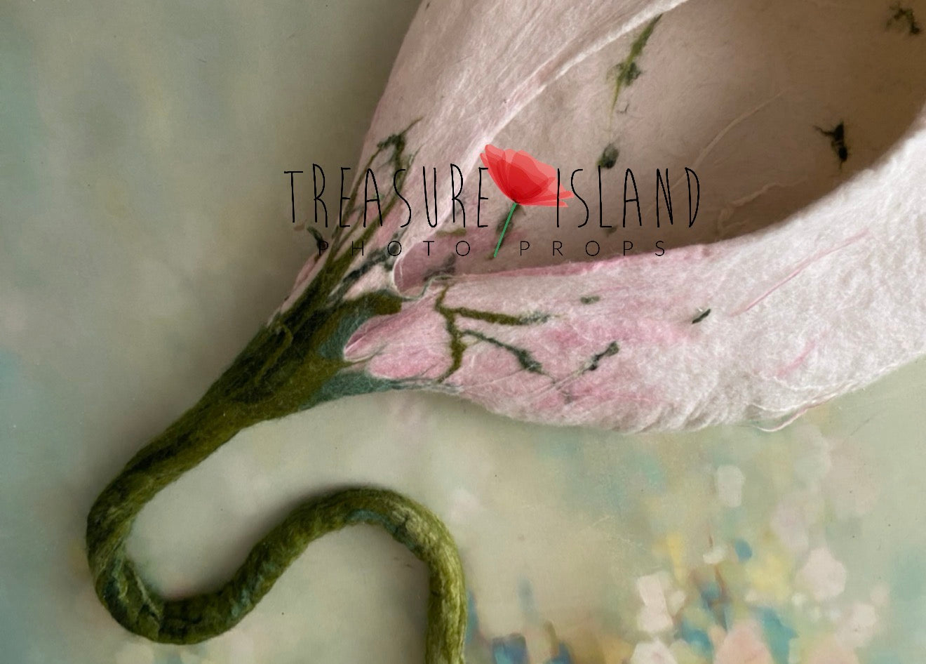 Detail of blush pink and white hand-felted flower cocoon with long green stem