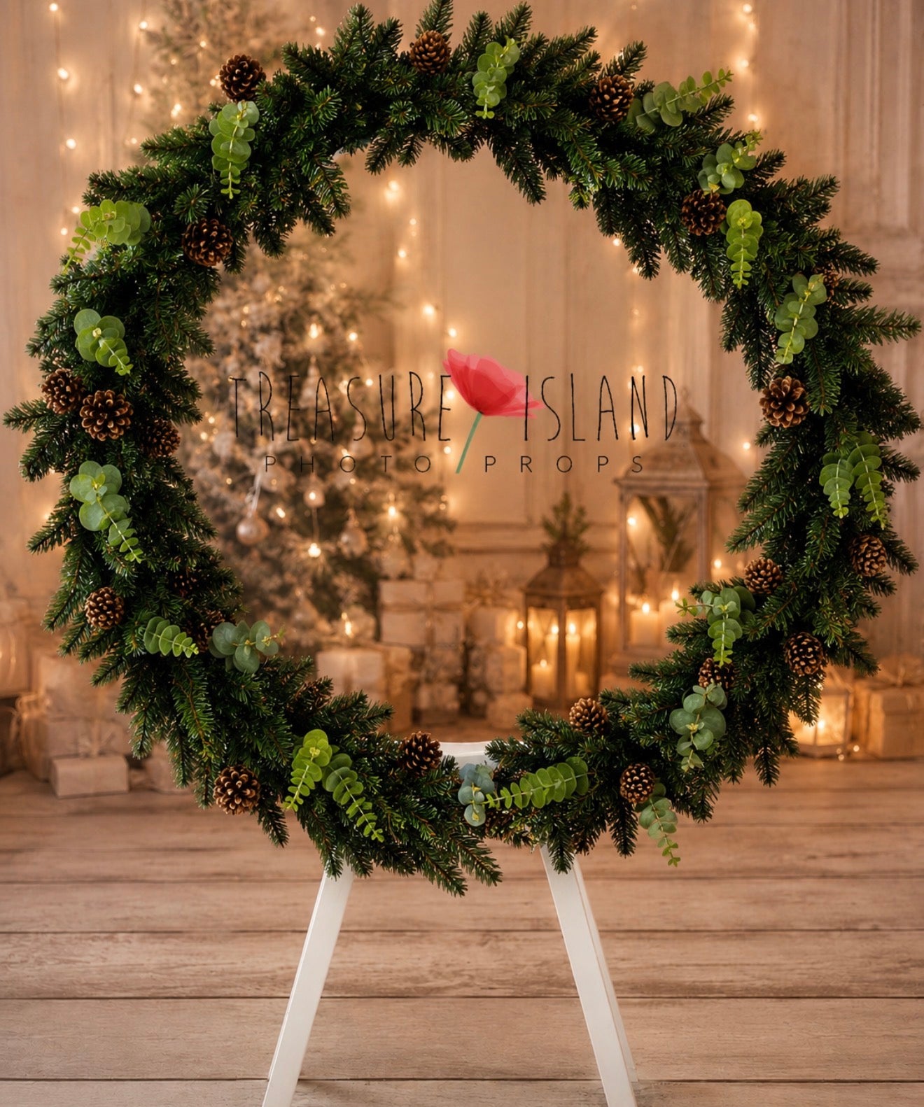 Evergreen Christmas pine garland with eucalyptus and pinecones arranged on a round frame for festive photography