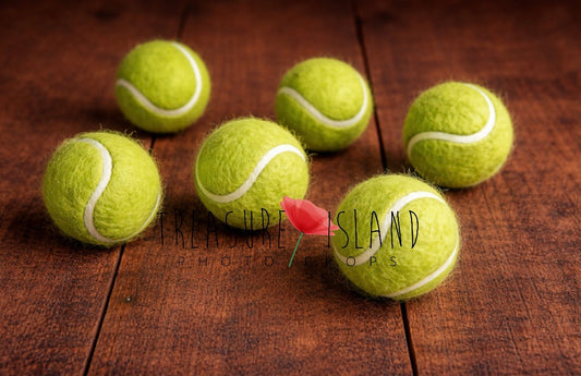 Light lemongrass yellow hand-felted tennis balls with white curved lines for newborn and sitter photography