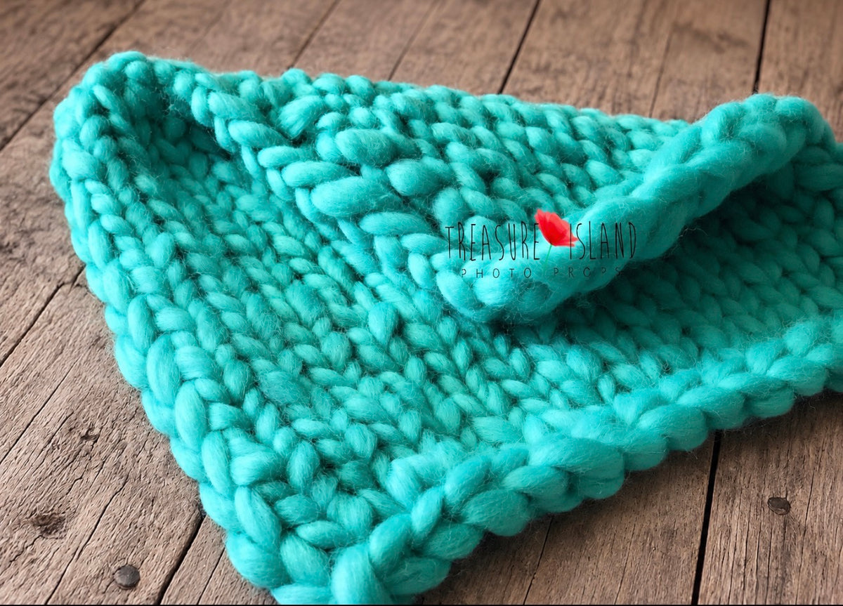 Cool mint chunky knit wool photography layer showing the handmade textured stitch
