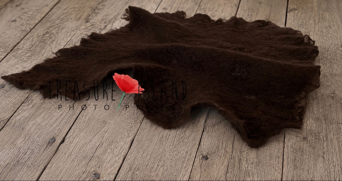 Dark chocolate hand-felted irregular wool blanket with organic edges for newborn photography