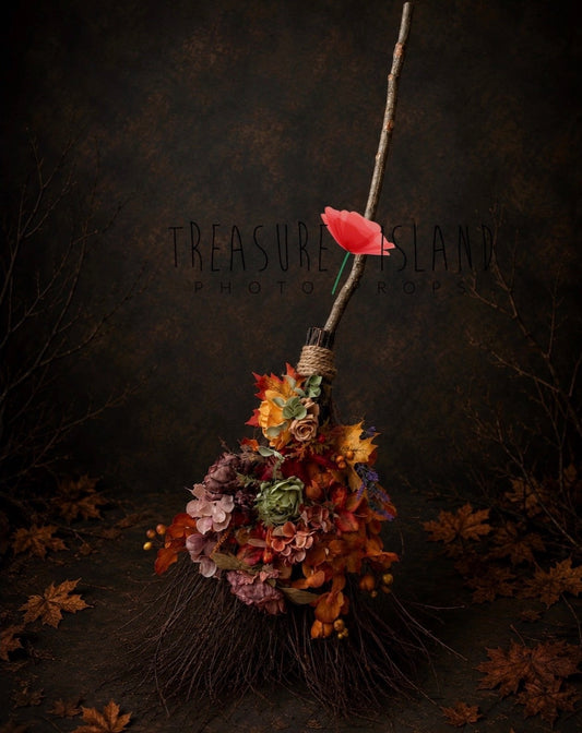 Enchanted autumn witch broom with floral decorations styled for Fine Art photography