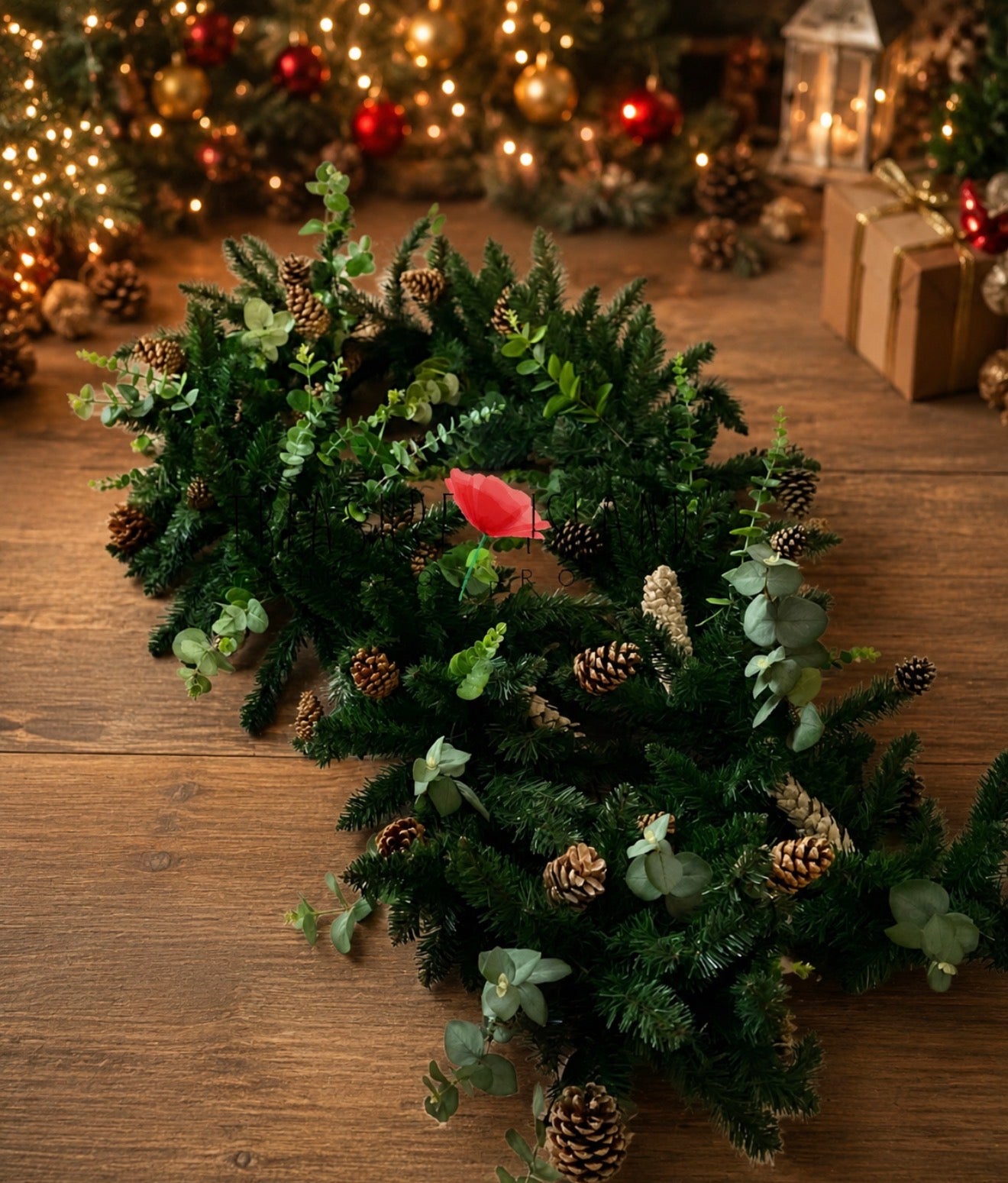Evergreen Christmas garland with eucalyptus and pinecones styled on a ladder for holiday photography