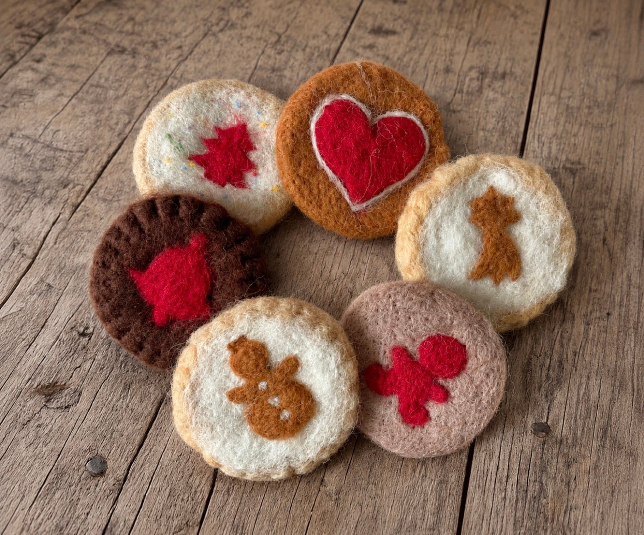 Handmade felted Christmas cookie photography props in assorted festive designs