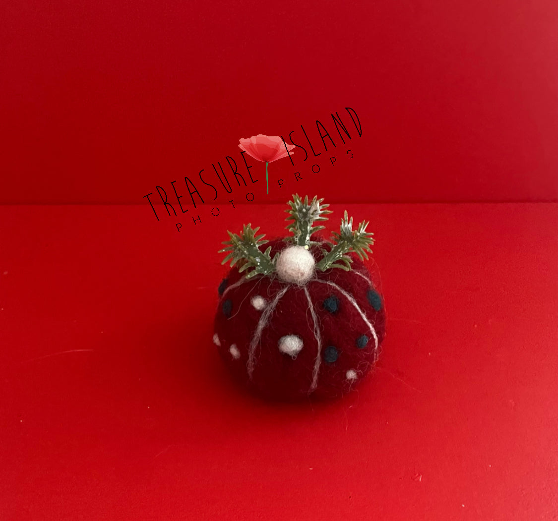 Mini handmade felted Christmas cupcake photography prop made from natural wool for festive newborn and sitter styling.