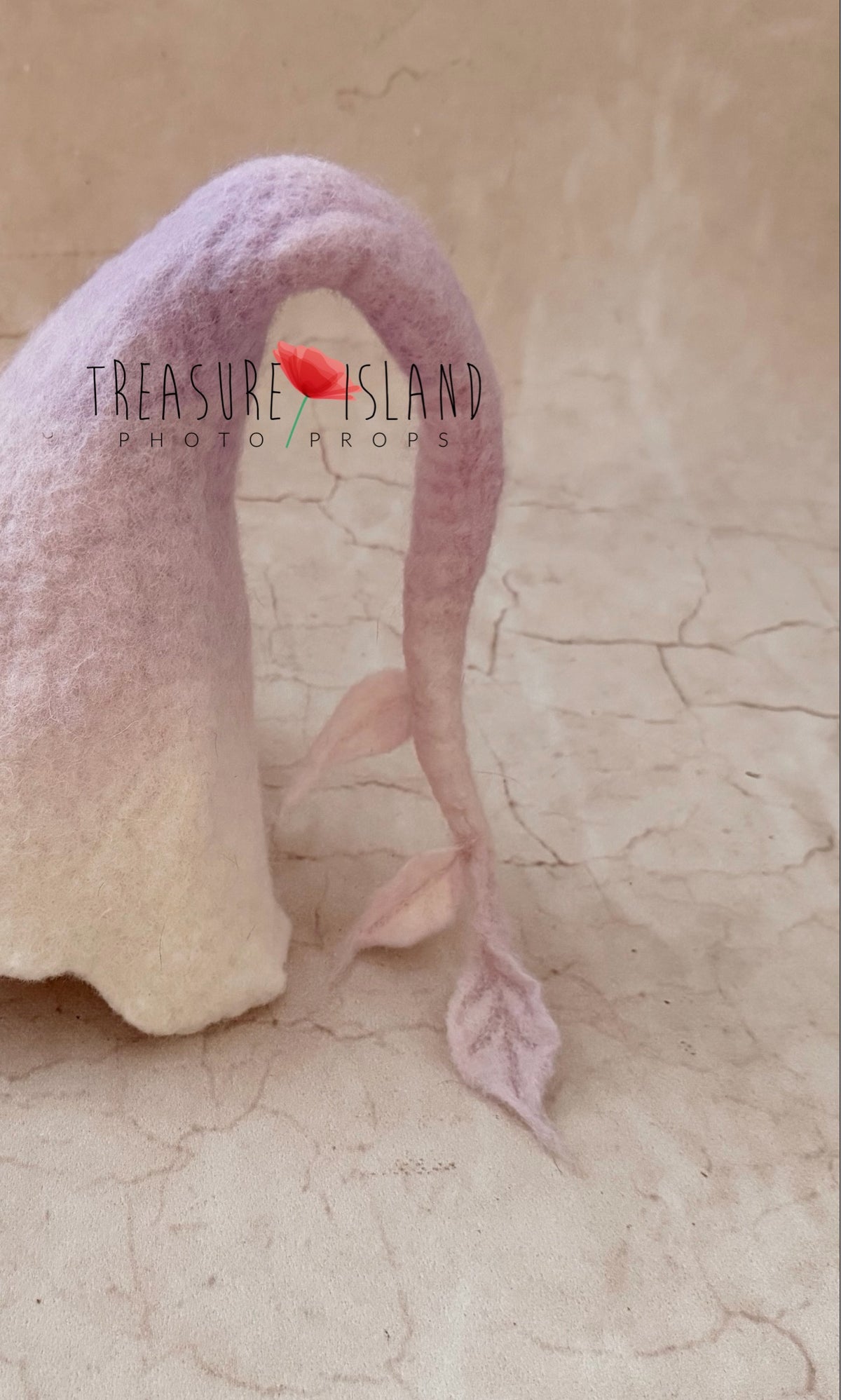 Close-up of hand-felted Moon Whisper newborn bonnet with delicate botanical leaf details