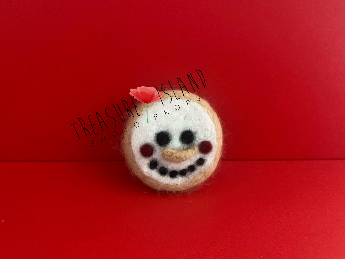 Handmade felted snowman cookie Christmas photography prop made from natural wool for newborn and sitter holiday sessions.