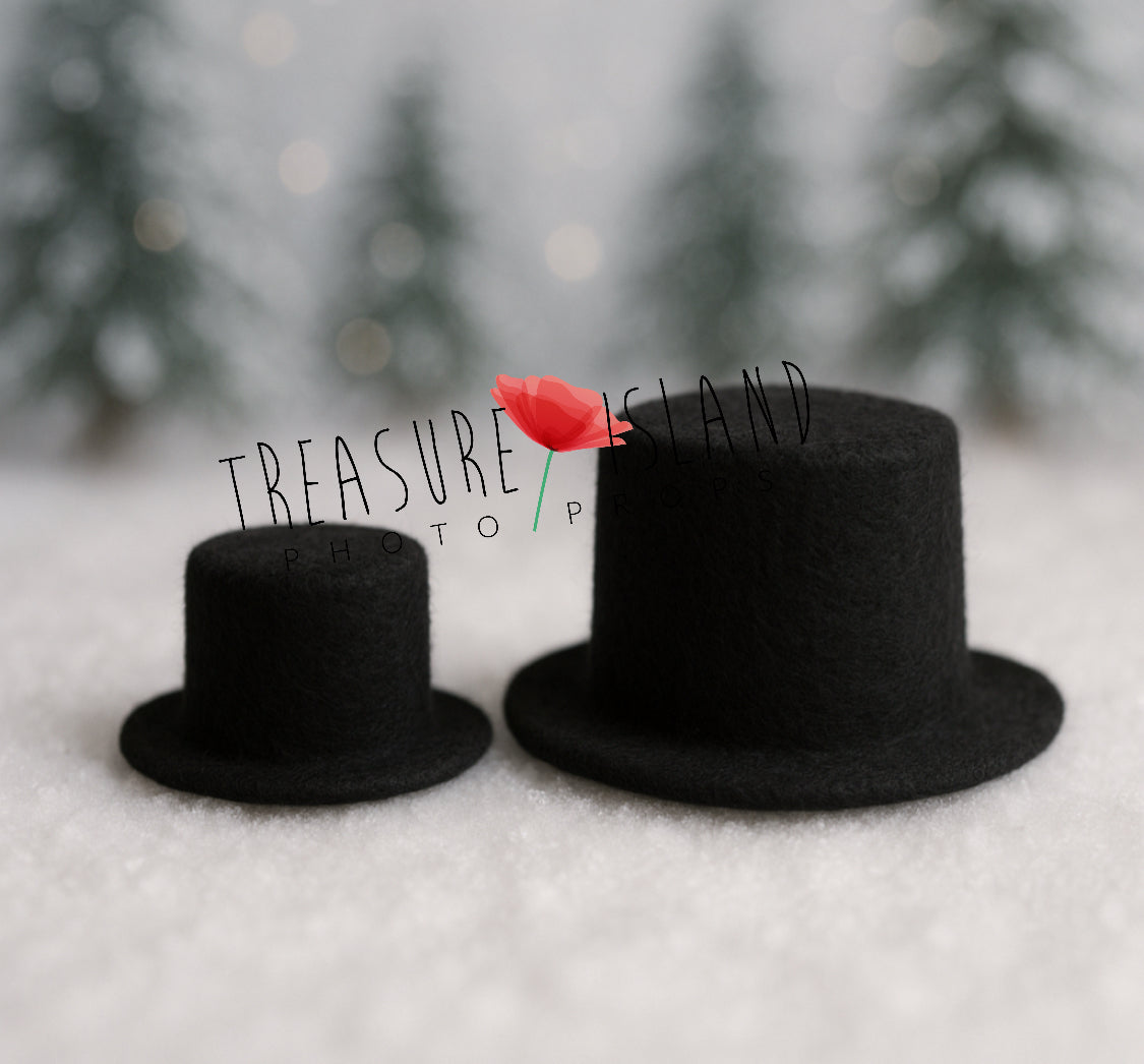 Two black hand-felted Snowman top hats in newborn and sitter sizes for winter baby photography
