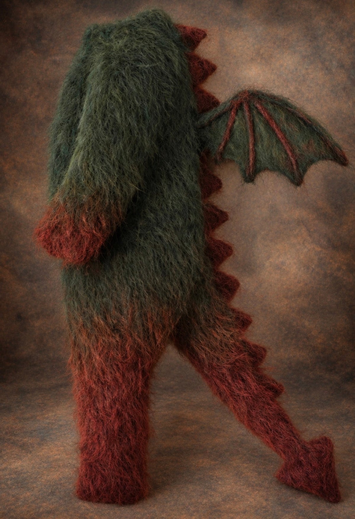 Forest green hand-knitted Dragon Romper with burgundy wings, spikes and tail for newborn and sitter fantasy photography