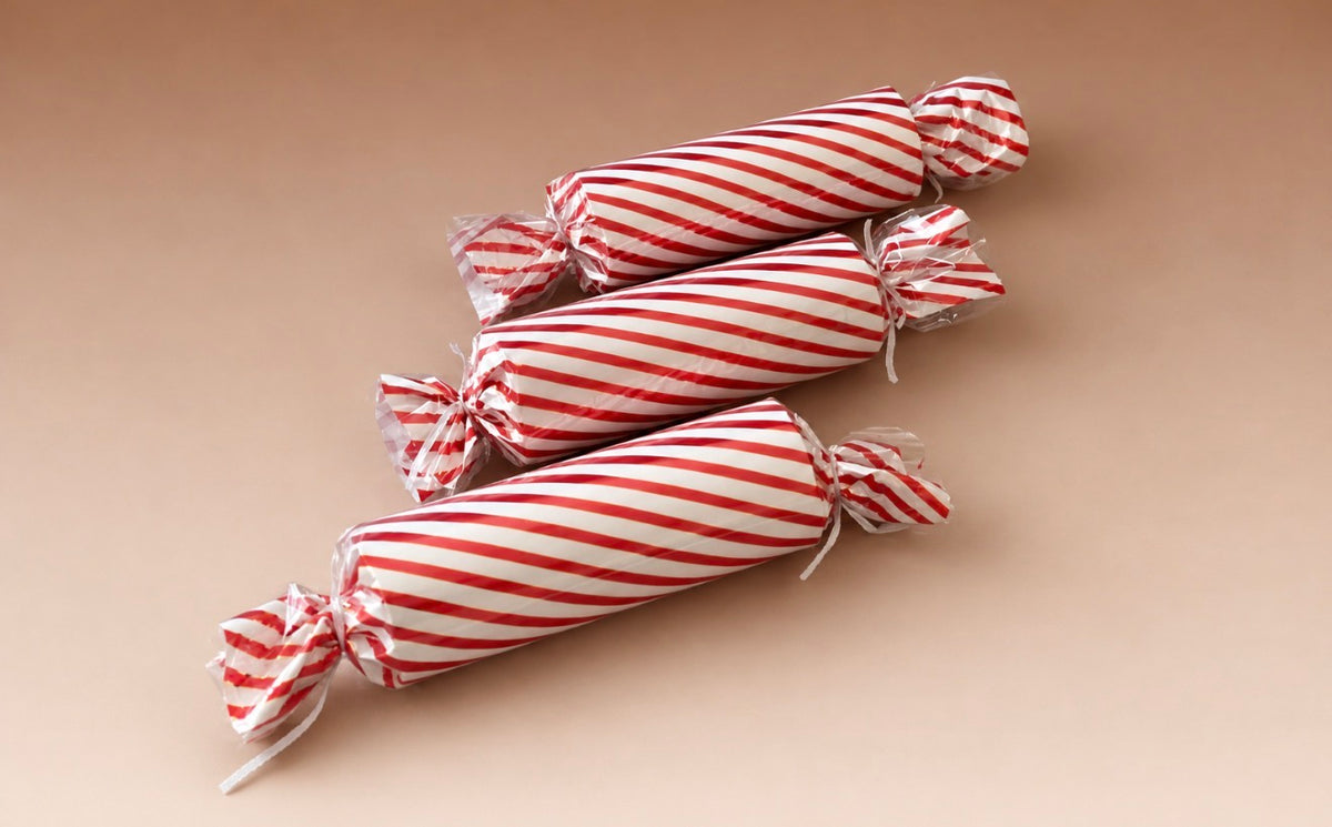 Giant red and white candy sweets for Candyland Christmas photography setups