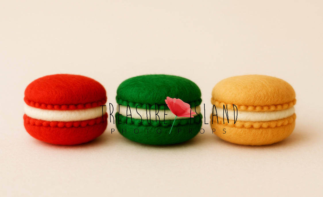Three hand-felted Christmas macaron photography props in red berry, pine green and golden honey with cream filling