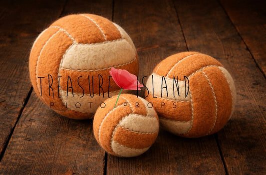 Hand-felted orange and natural white indoor volleyball balls in three sizes for newborn and sitter photography