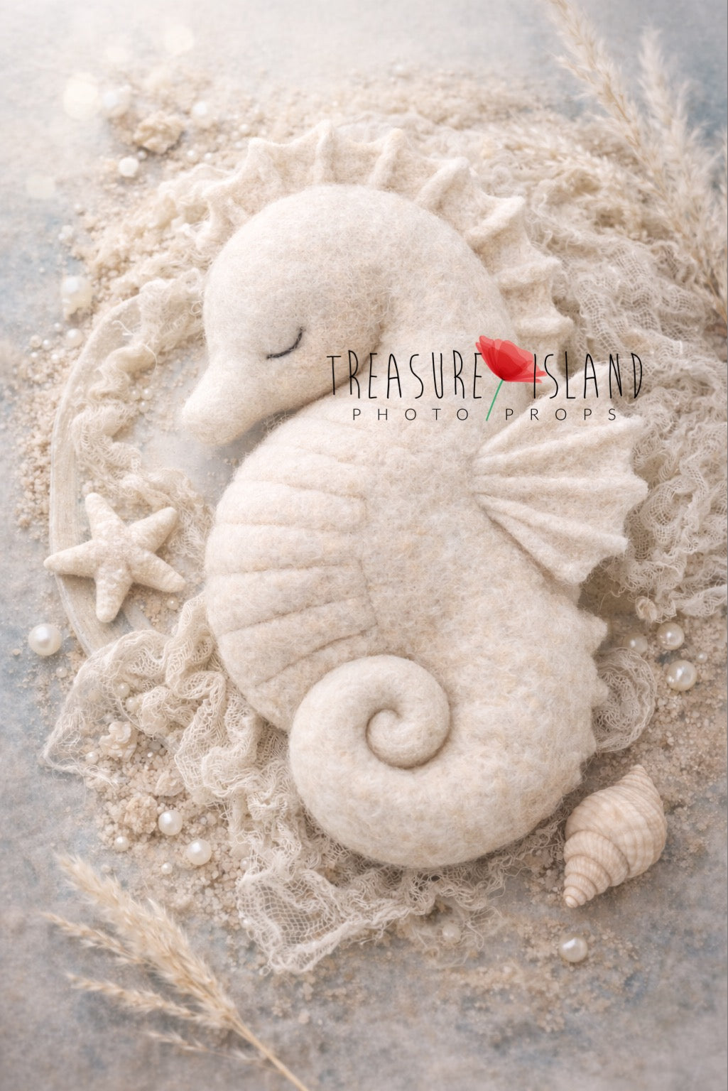 Large hand felted seahorse posing pillow in soft ivory and blush pink for ocean themed newborn photography