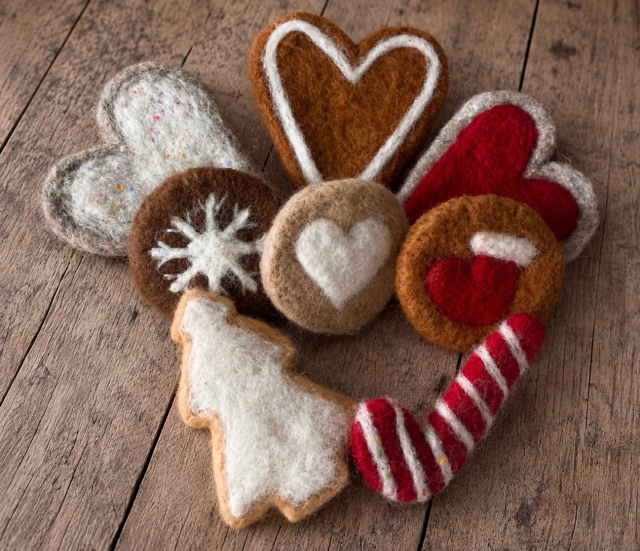 Handmade felted Christmas sweets including hearts, tree and candy cane photography props