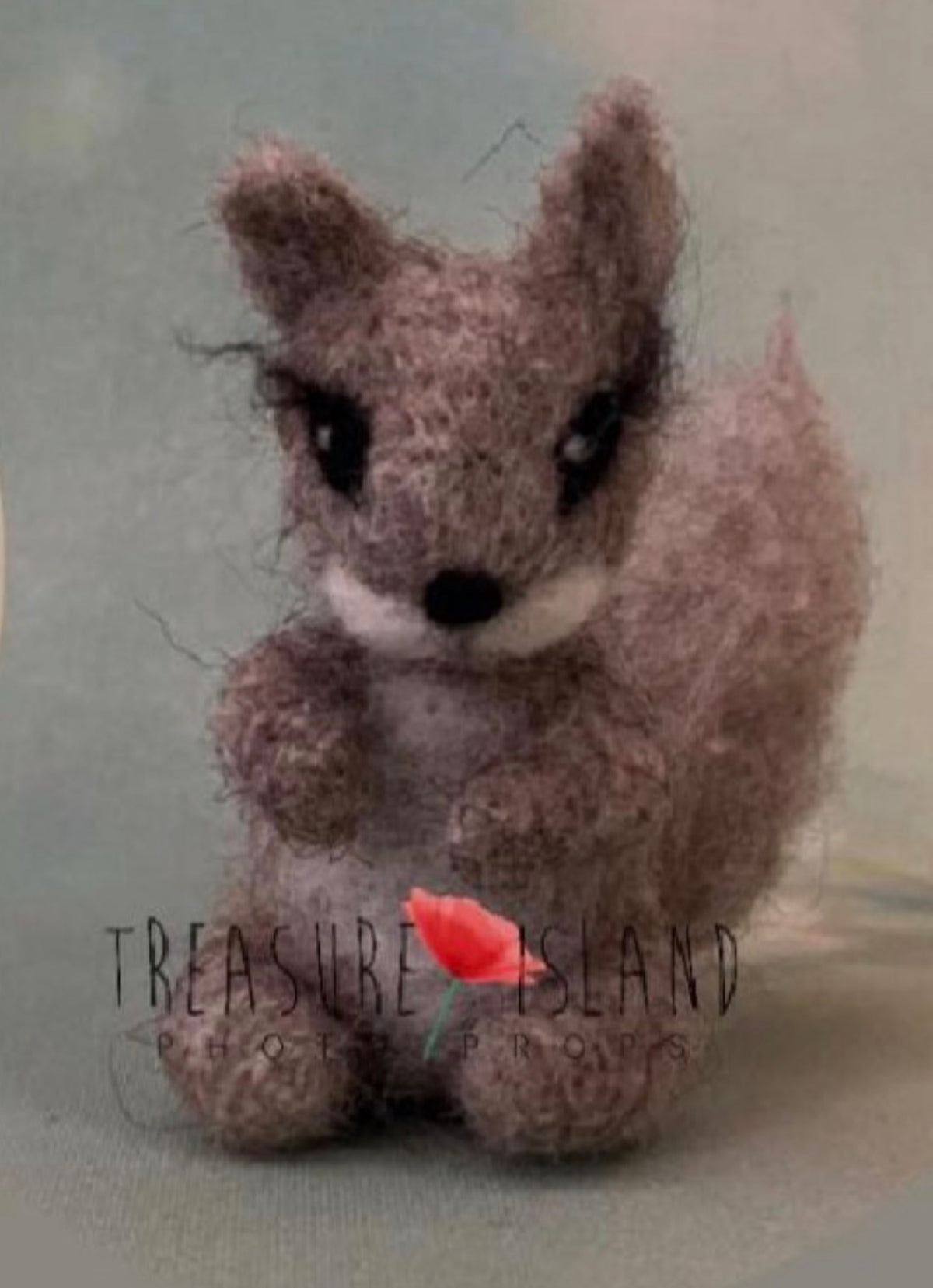 Handmade felted woodland squirrel companion with sculpted tail and natural wool texture