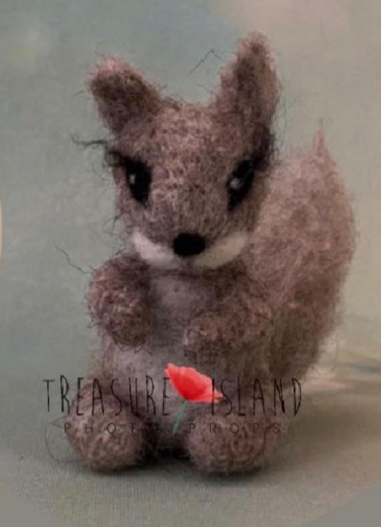 Handmade felted woodland squirrel companion with sculpted tail and natural wool texture