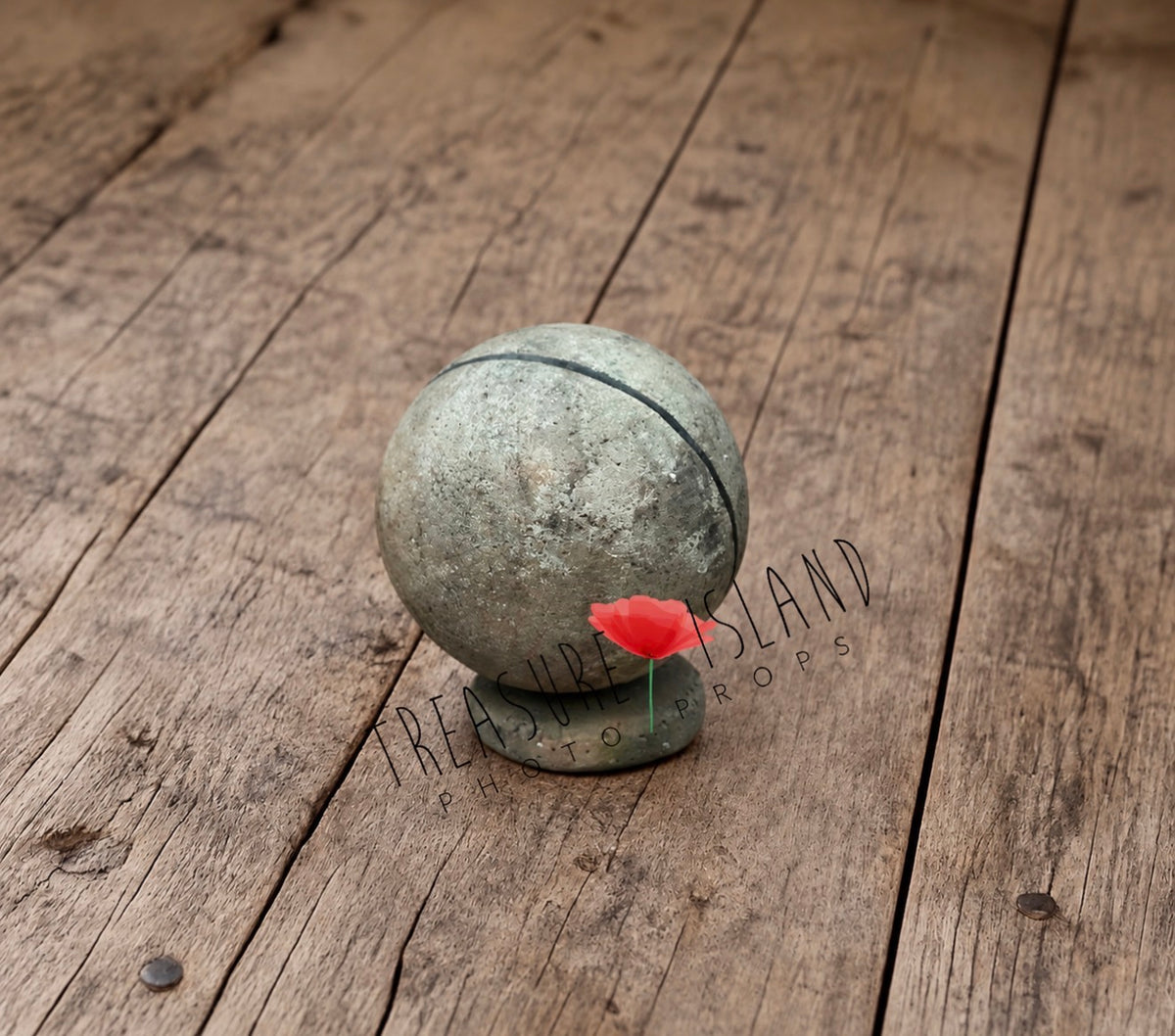 Textured grey-green styrofoam globe on a small rounded stand, photographed at an angle as a decorative prop for back-to-school photography sessions