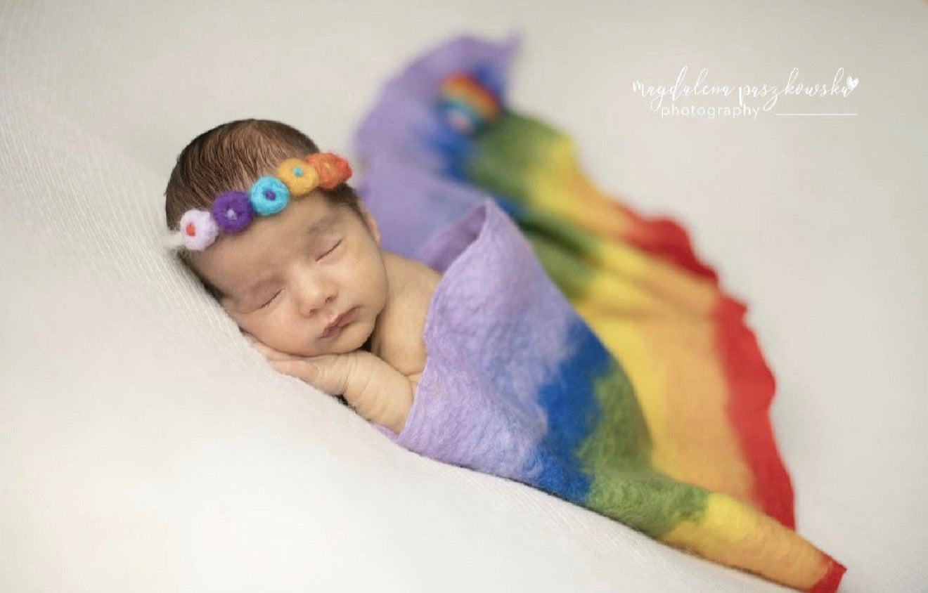 Thin handmade rainbow felted wrap used for textured newborn styling