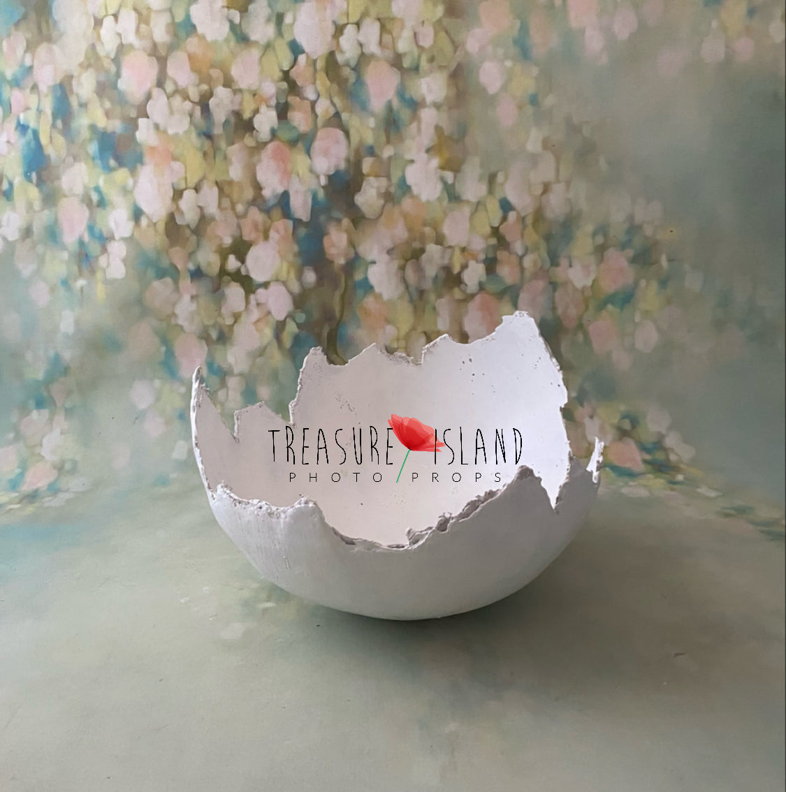 Plaster egg shell photography prop with hand-shaped irregular opening