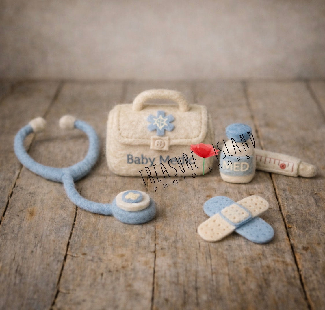 Cream and soft blue Little Doctor newborn photography prop set with hand-felted medical bag, stethoscope, medicine bottle, thermometer and plasters