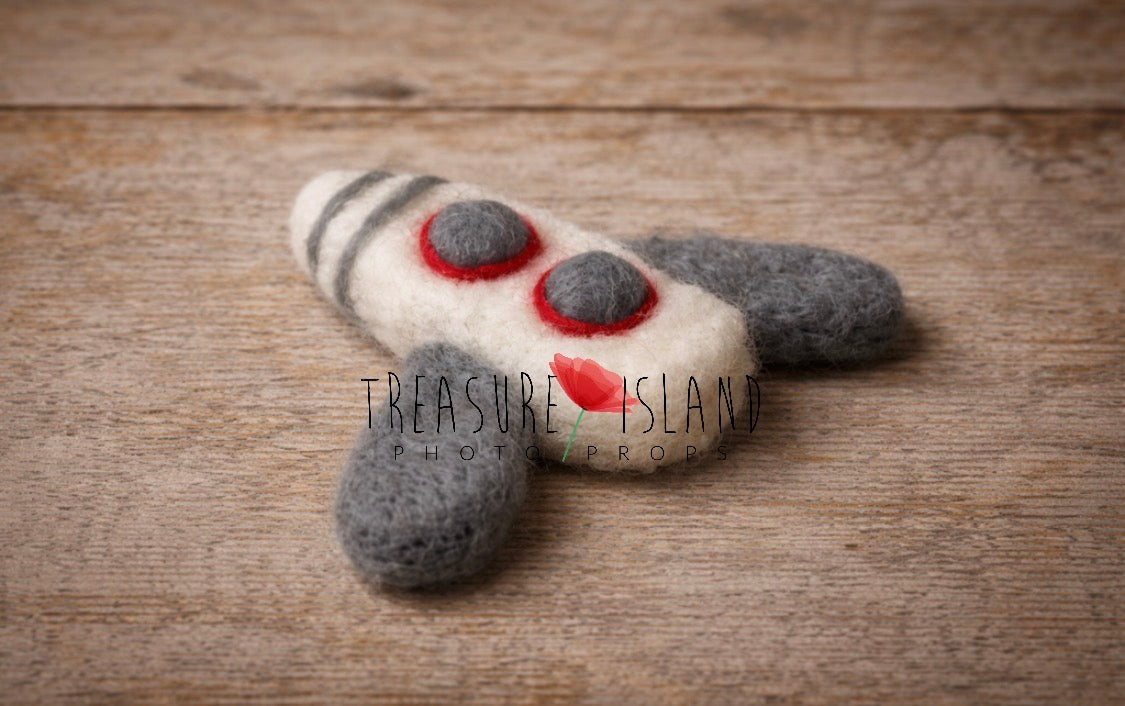 Miniature hand-felted airplane prop for newborn pilot photography