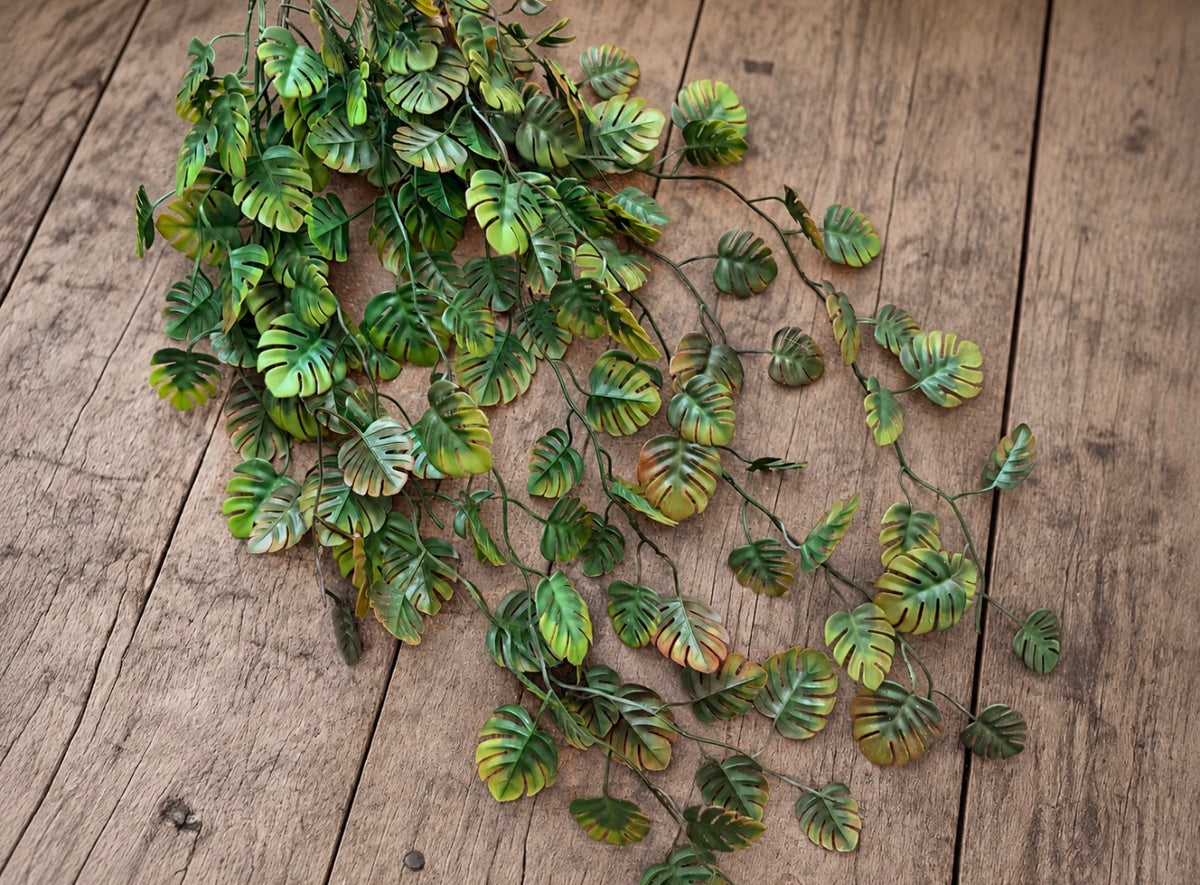 Cascading mini monstera garland with mixed green leaves for Safari and nature-inspired photography