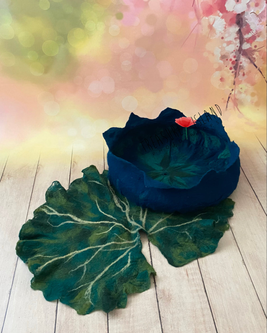 Noctulina Midnight Bloom hand-felted blue floral bowl with large green botanical leaf for newborn photography