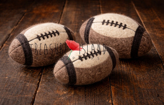 Three hand-felted vintage-style rugby balls in different sizes for newborn and sitter photography