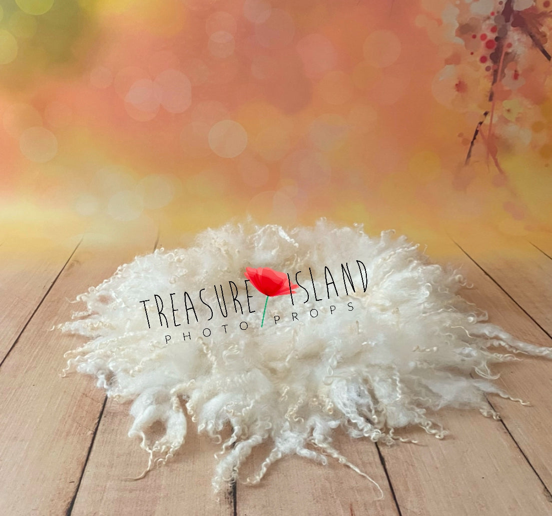Pearl White sheep curl photography layer styled around a newborn in a rustic setup