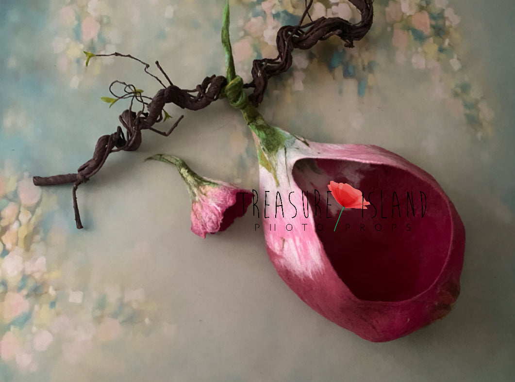 Pink hand-felted flower cocoon with long green stem for newborn photography